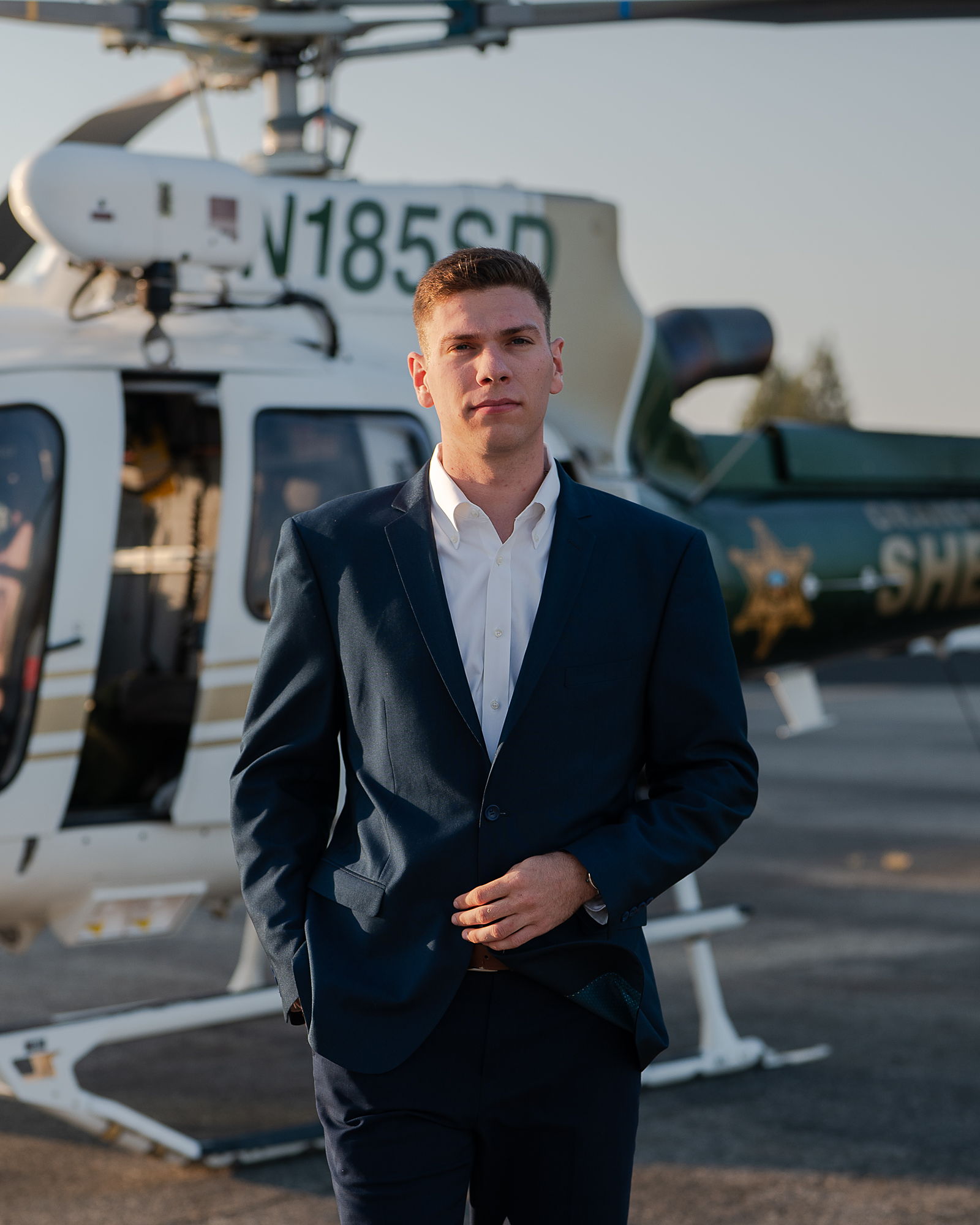 Portrait of Sam Marino in a navy suit.