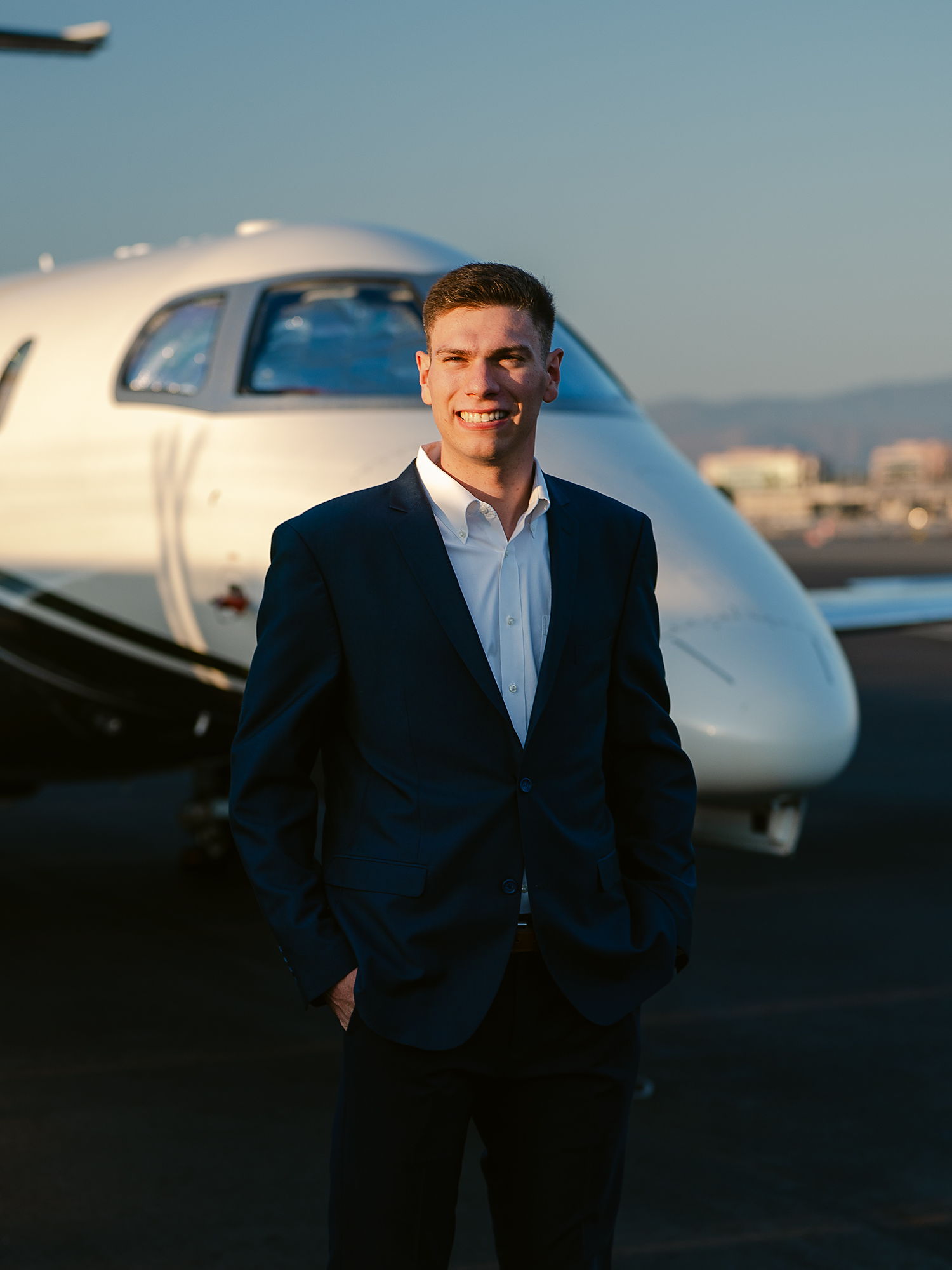 Portrait of Sam Marino in a navy suit.